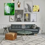 Angela Faustina's oil paintings Kiwi I and Lemon I hanging in situ on a gallery wall in a contemporary living room.